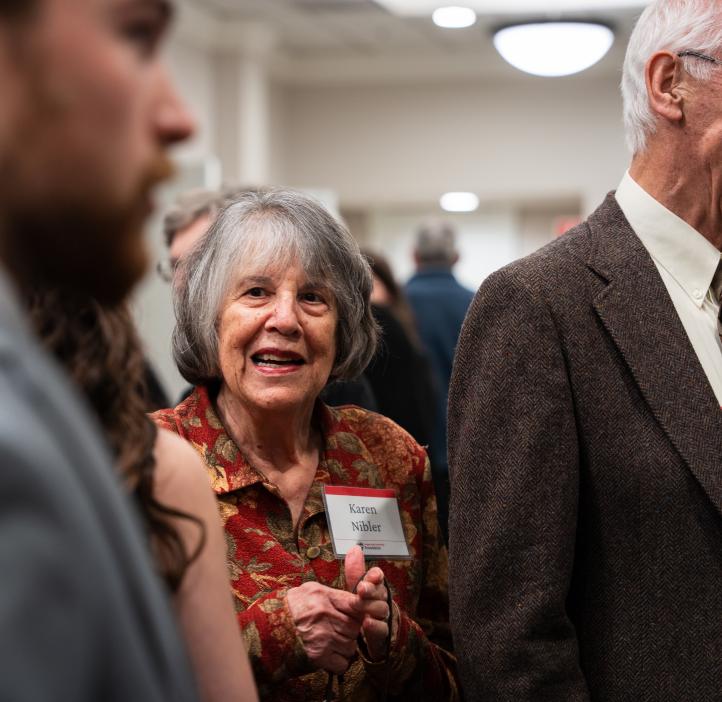 A woman smiles during the College of Science Alumni Awards.